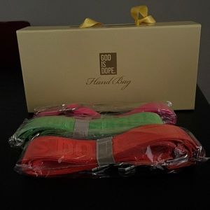 Brand new God Is Dope handbag with 4 straps: black orange pink green.